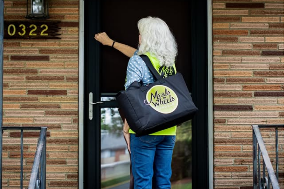 A Meals on Wheels People volunteer bring social connection and nutrition to a homebound senior.